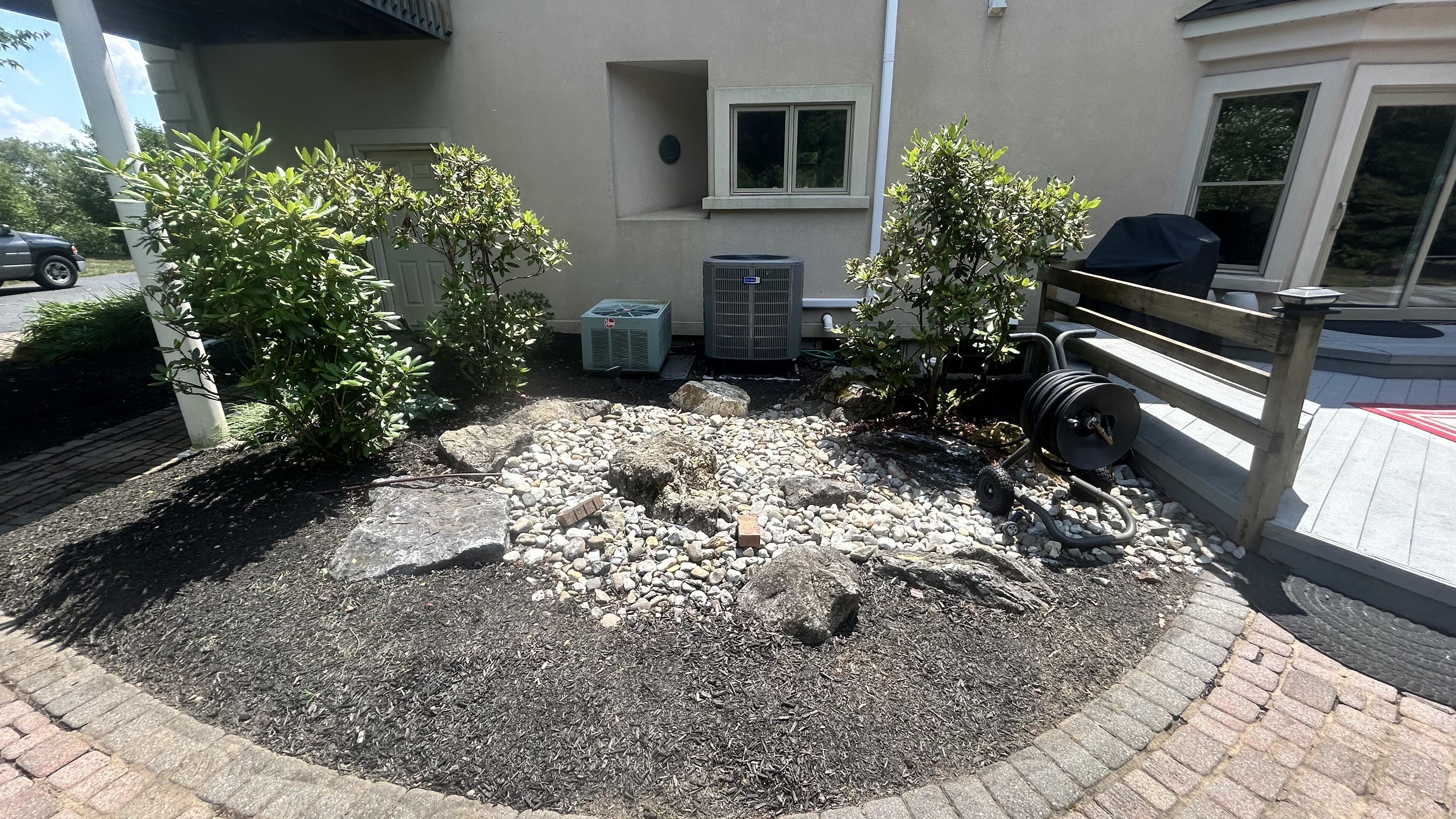 Before: HVAC area requiring professional landscaping